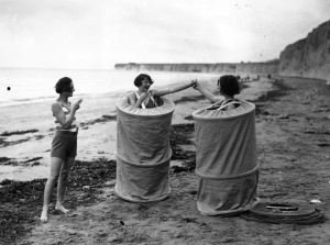 vintage-women-changing-on-beach